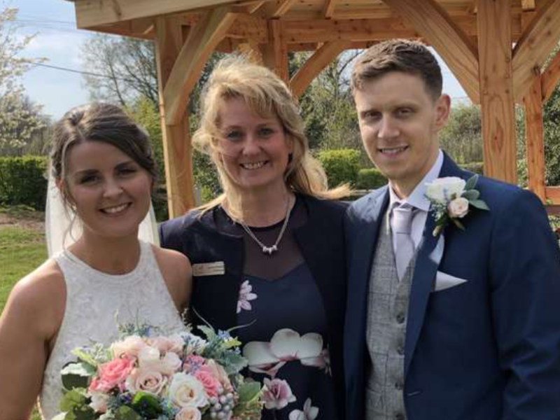 bride and groom with the celebrant