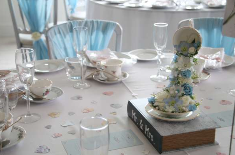 Wedding breakfast set up with flower centrepiece