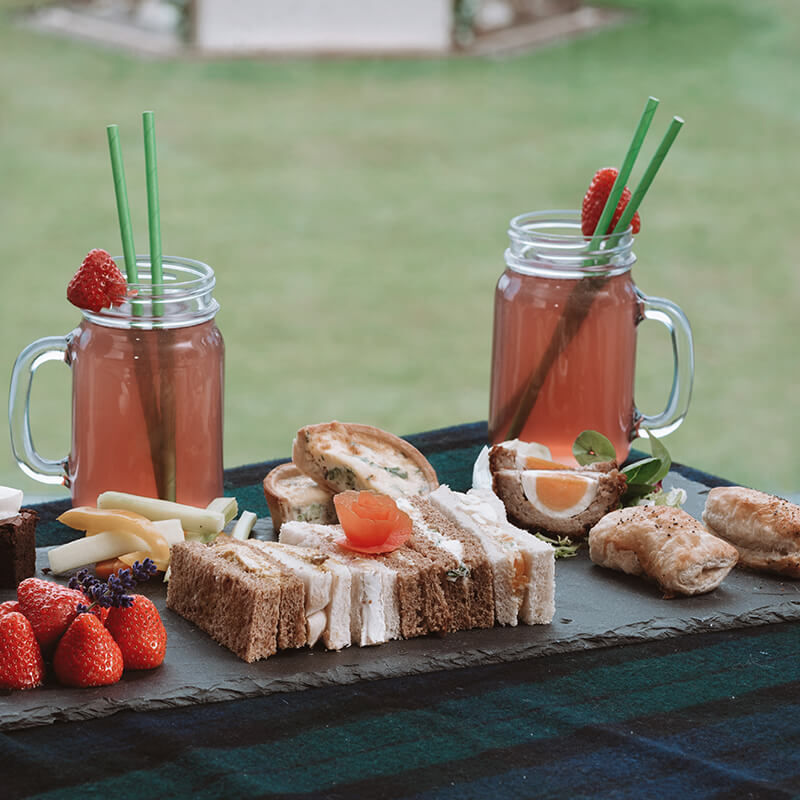 selection of picnic food and drinks at wedding