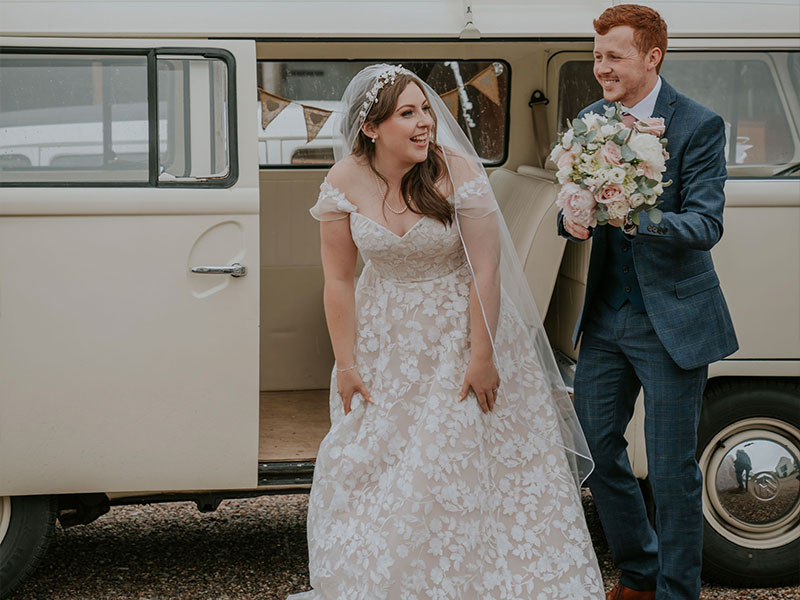 bride and groom in front of vintage van