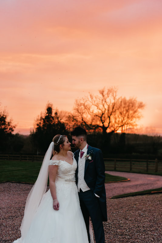 sunset photograph of the bride and groom
