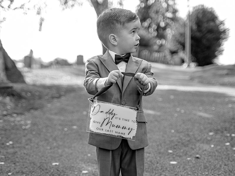 Child with wedding sign for parents