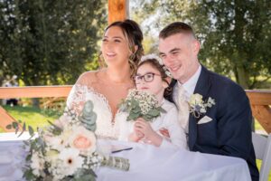 Bride and Groom with their daughter at their ceremony