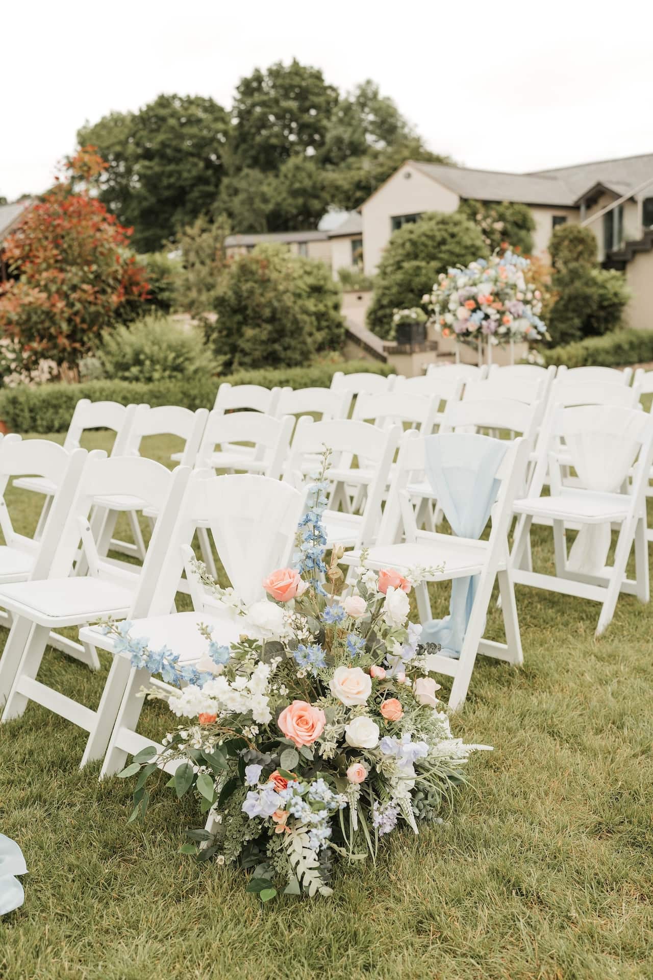 Outdoor ceremony seating with the house