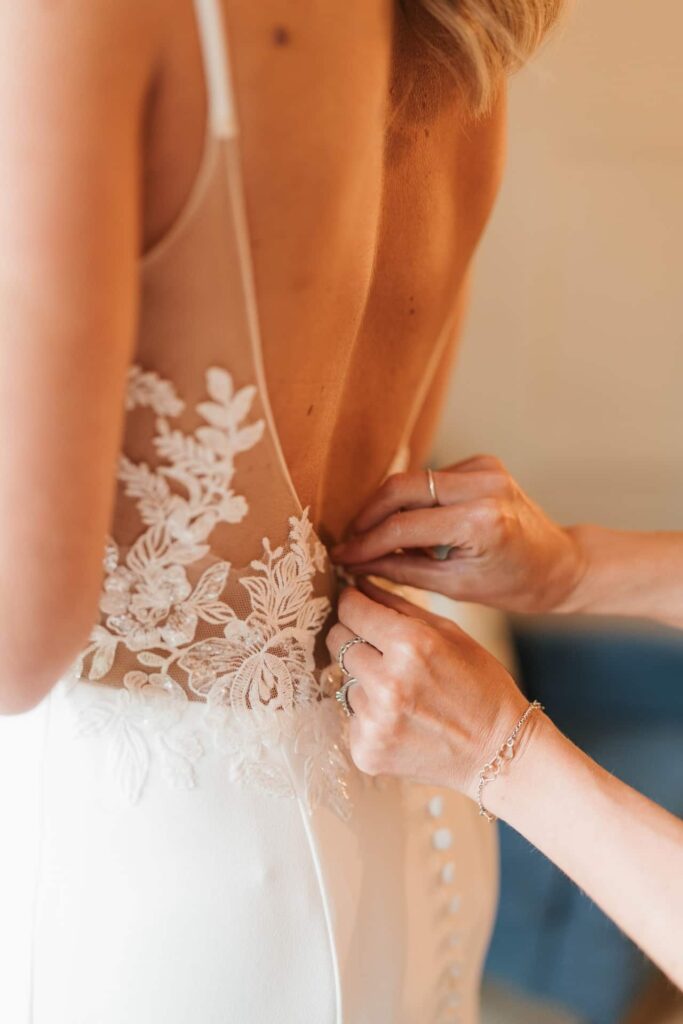 Bride in wedding dress getting ready