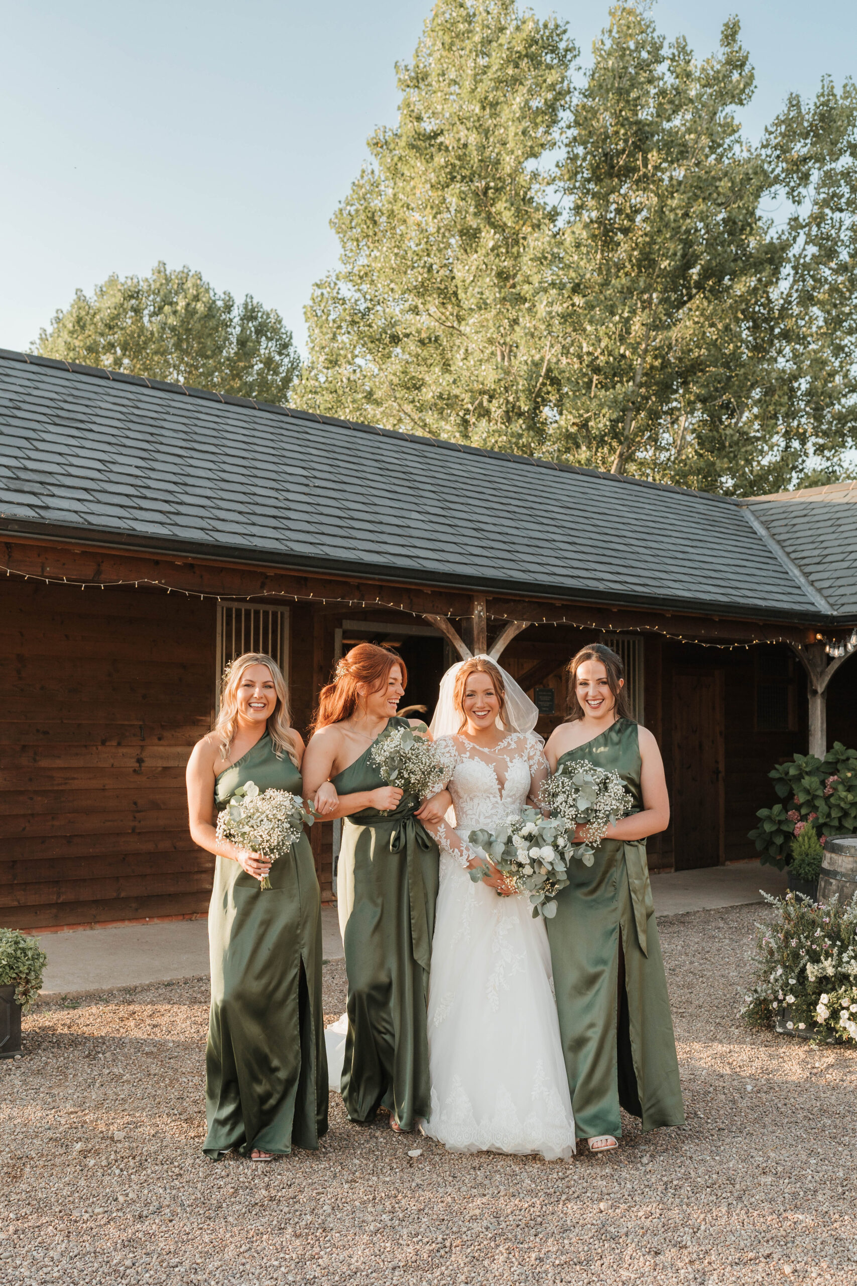 Bridesmaids outside the barn