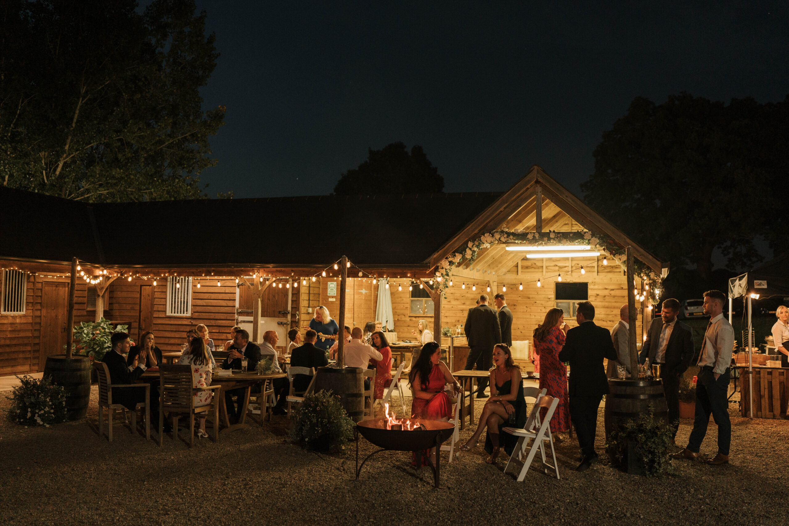 Wedding barn with guests at night