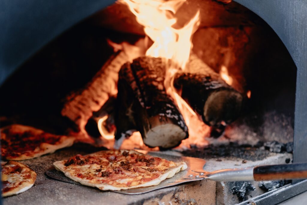 Pizza oven cooking pizzas for a wedding