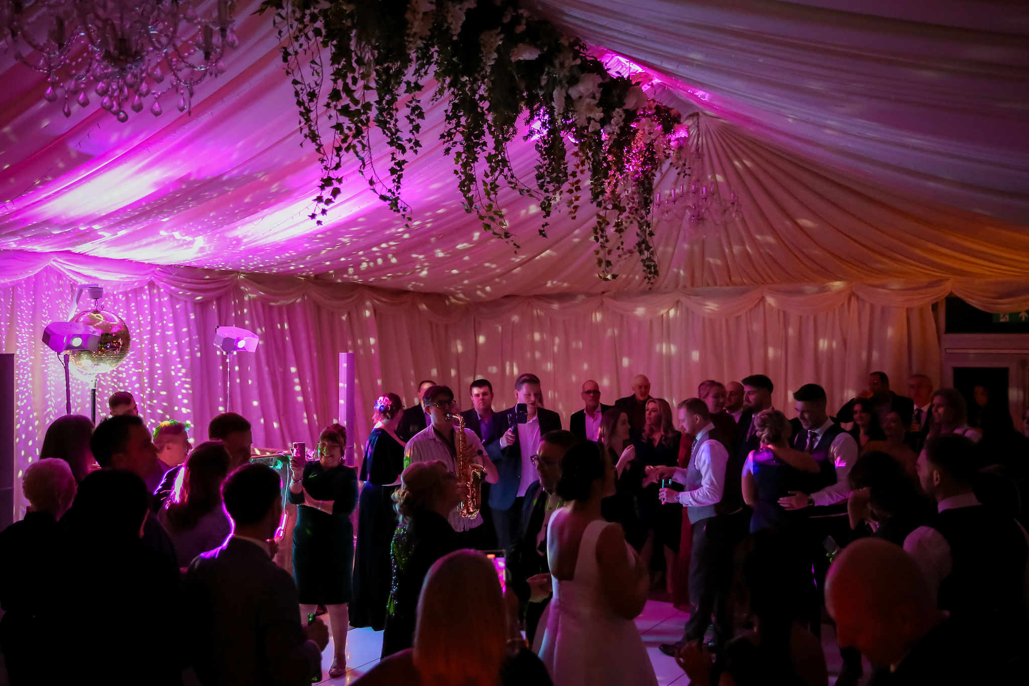 Wedding guests dancing in the marquee