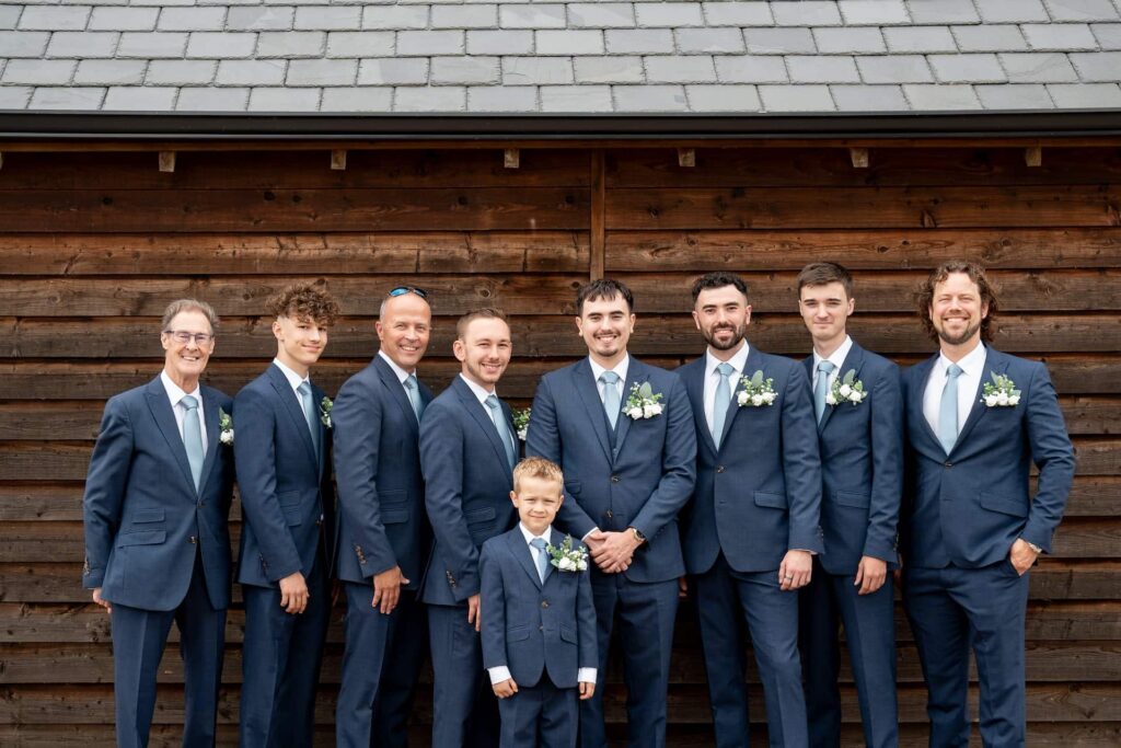 Groomsmen photos outside of the barn