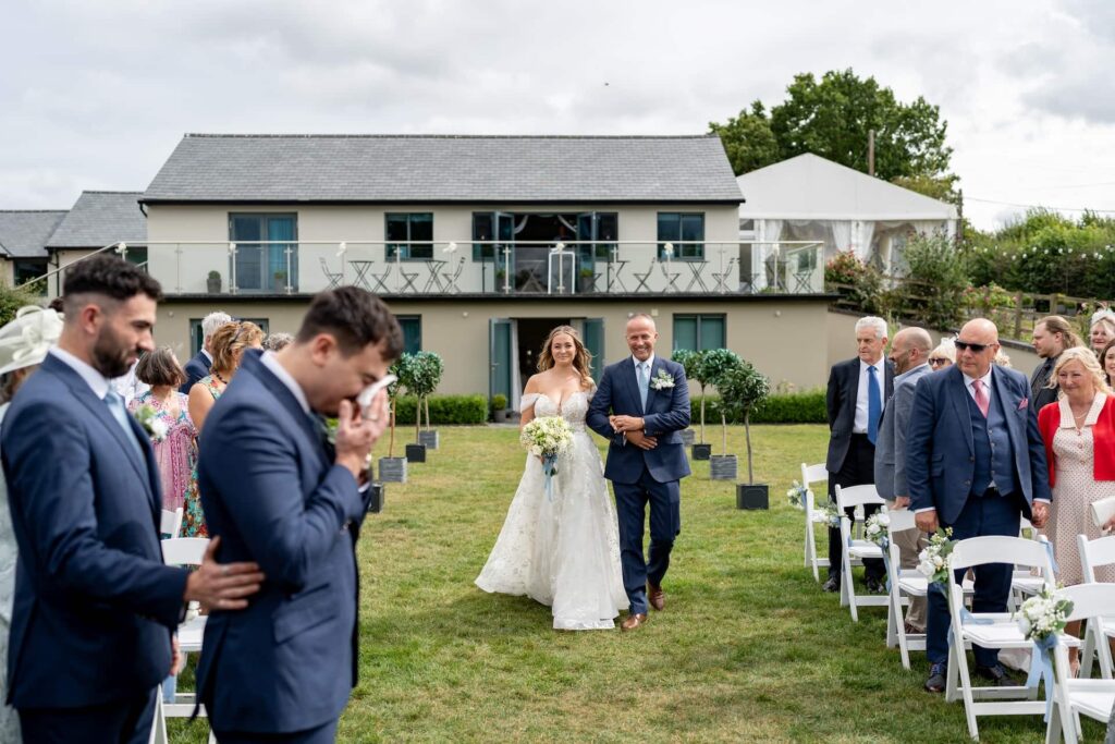 Bride walking down the aisle from the honeymoon suite