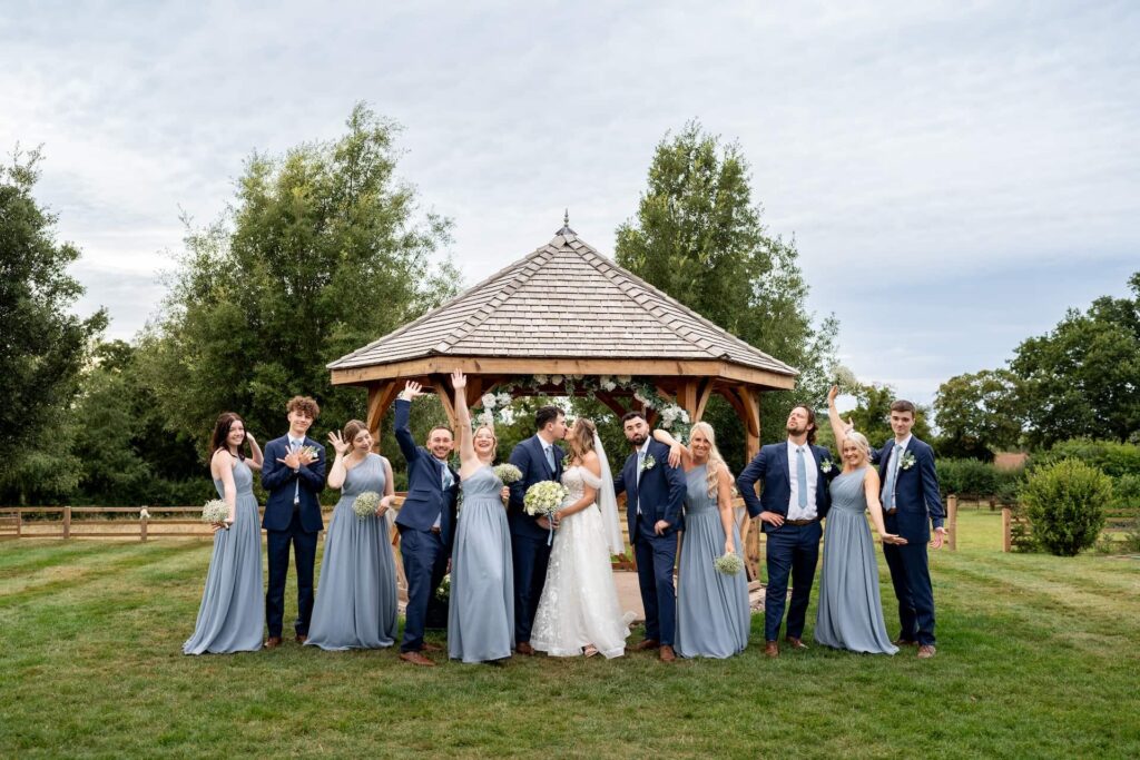 Bridal party pictures on the lawn by the pavilion